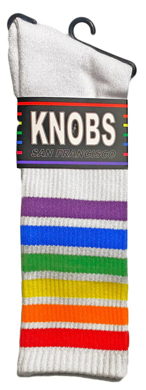 White knit rainbow tube socks with vibrant stripes and black knobs san francisco hanger tag