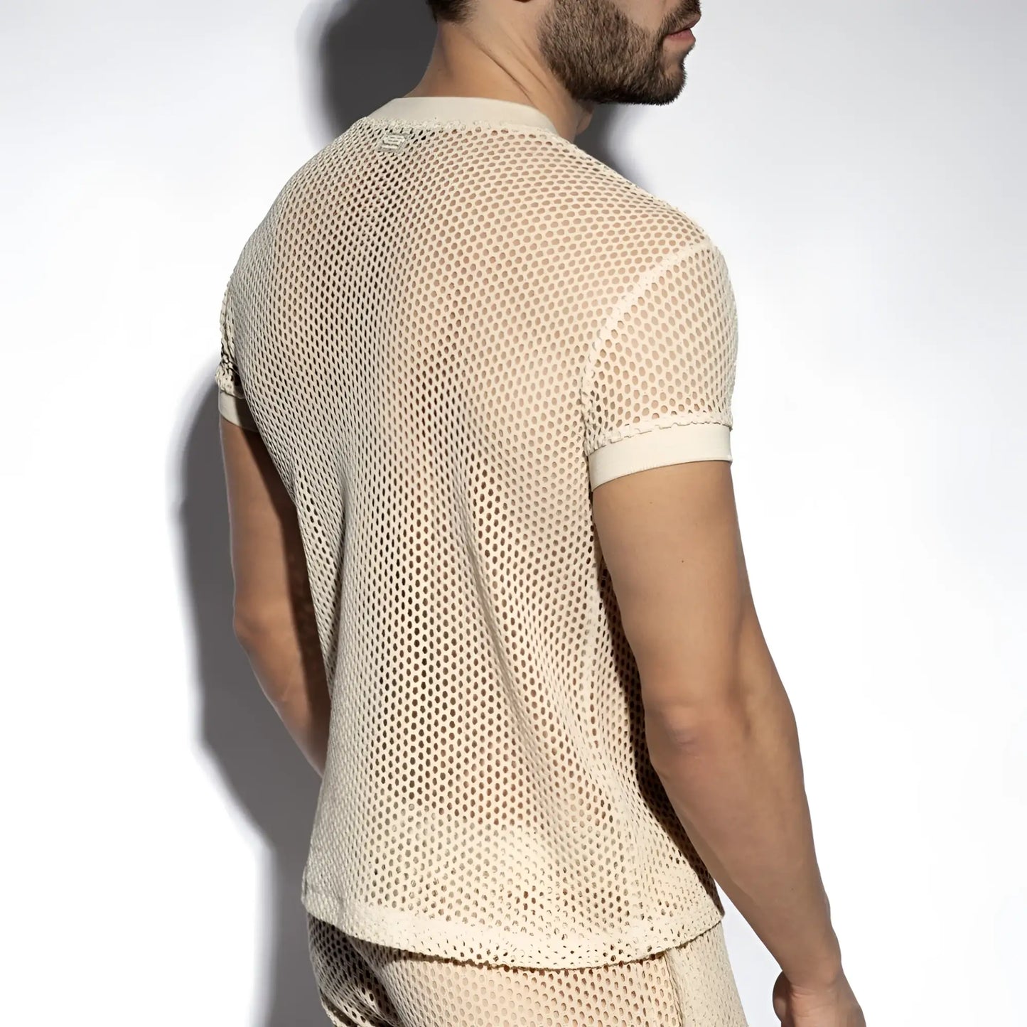 Beige raw crochet t-shirt with mesh fabric, short sleeves, round neckline, and solid ribbed cuffs
