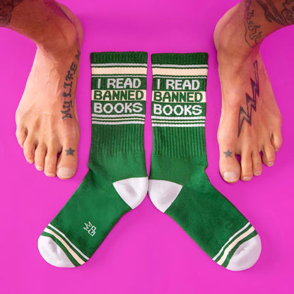 Green crew socks with white accents and bold black i read banned books text featuring ribbed texture and reinforced toes