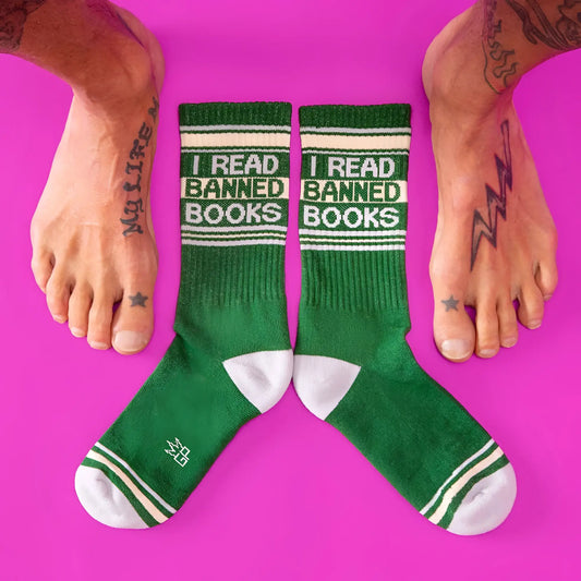 Green crew socks with white accents and bold black i read banned books text featuring ribbed texture and reinforced toes