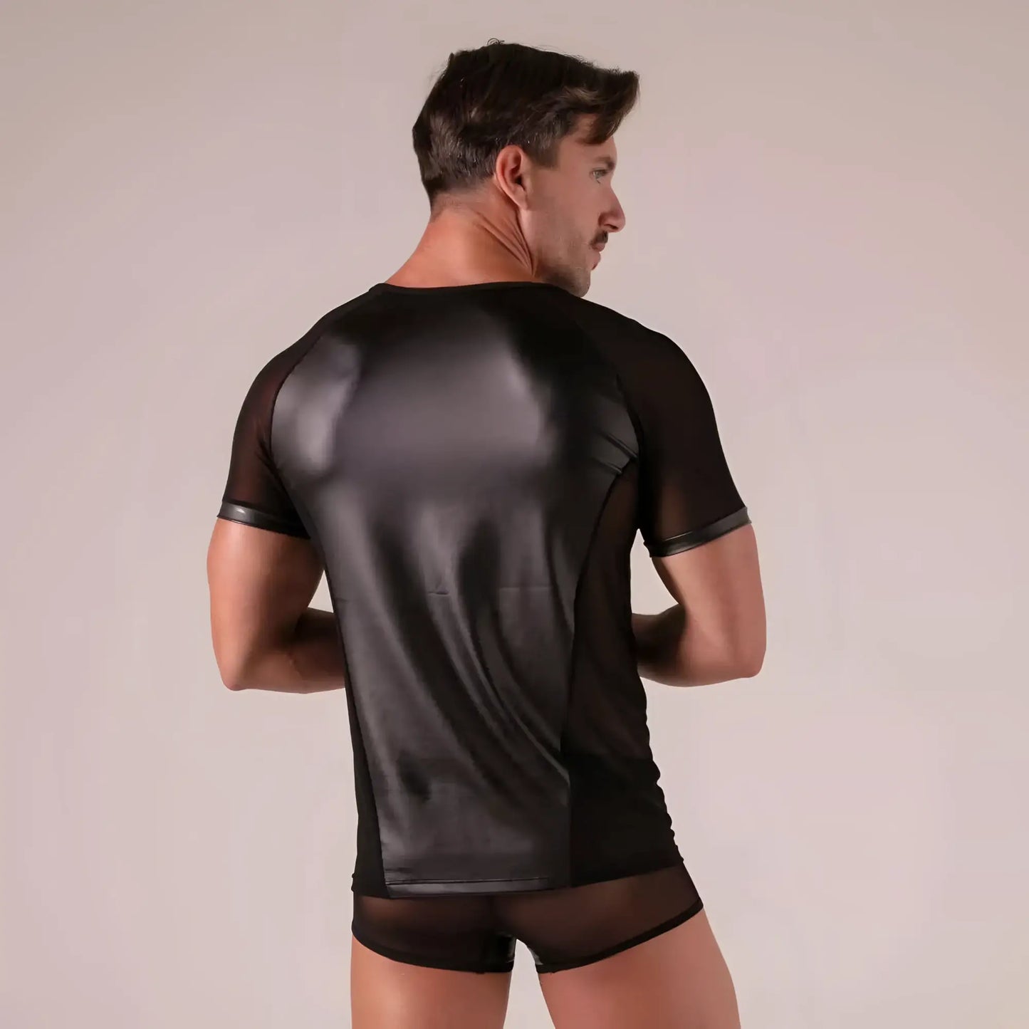 Black rebel t-shirt showing back side with glossy faux leather panel and sheer mesh sleeves and sides