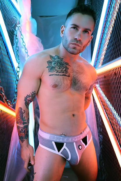 Gray and white retro remix athletic briefs with black triangular cutouts and breed logo waistband for active wear