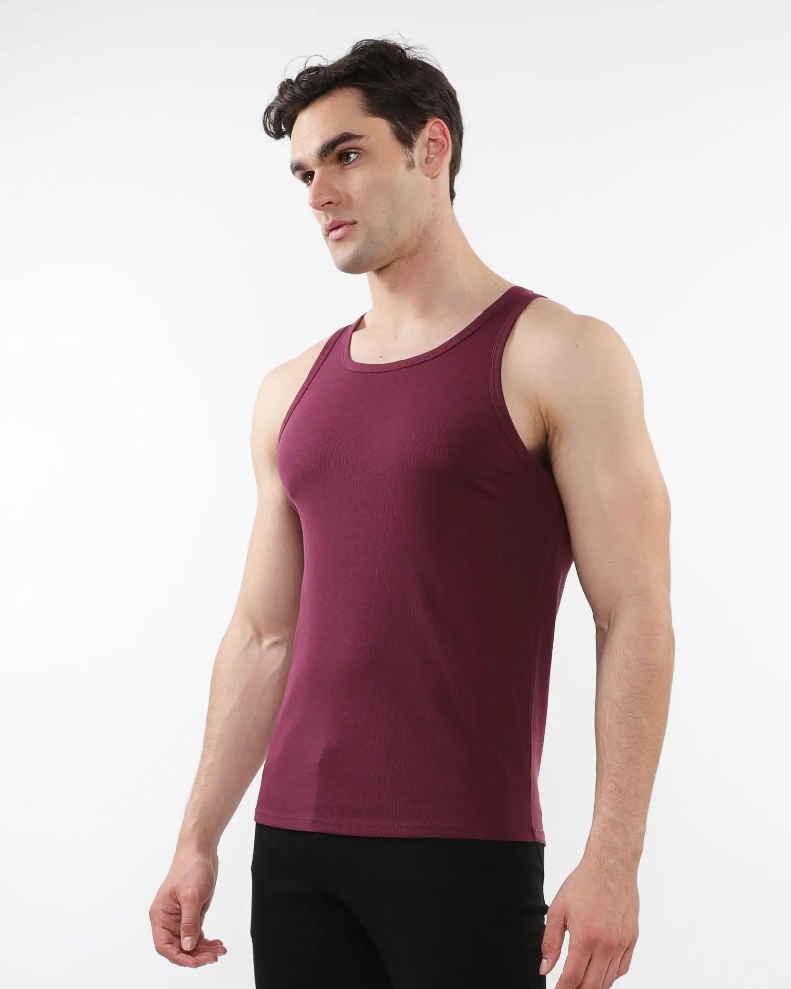 A maroon rib stretch tencel cotton sleeveless tank top with a round neckline and smooth form fitting fabric