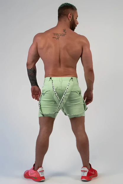 Romey shorts light green cargo shorts with black and white patterned straps shown from the back side