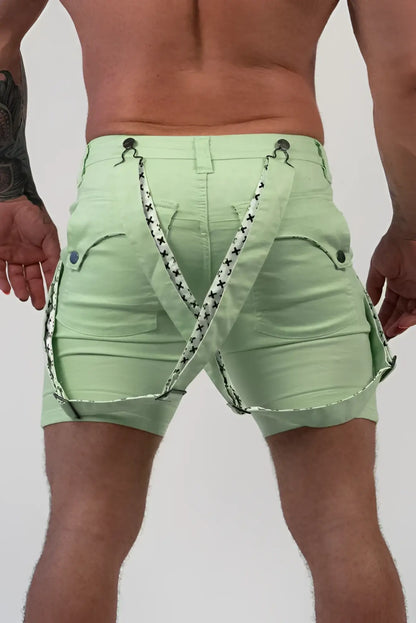 Light green denim Romey shorts with black and white star-patterned suspenders for casual wear