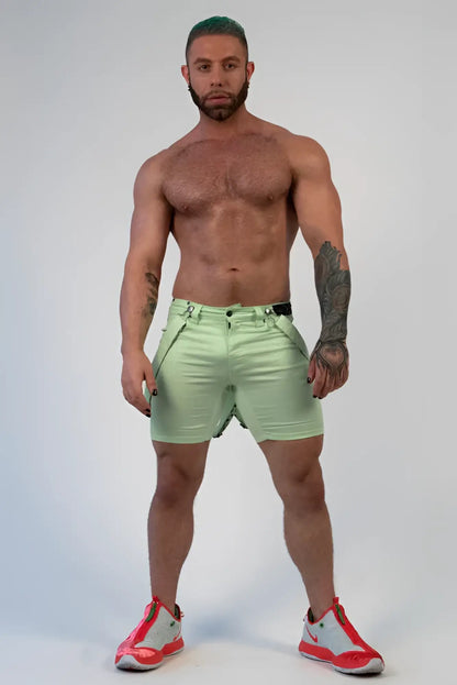 Romey shorts light green with subtle sheen and visible stitching details in lightweight fabric for casual wear