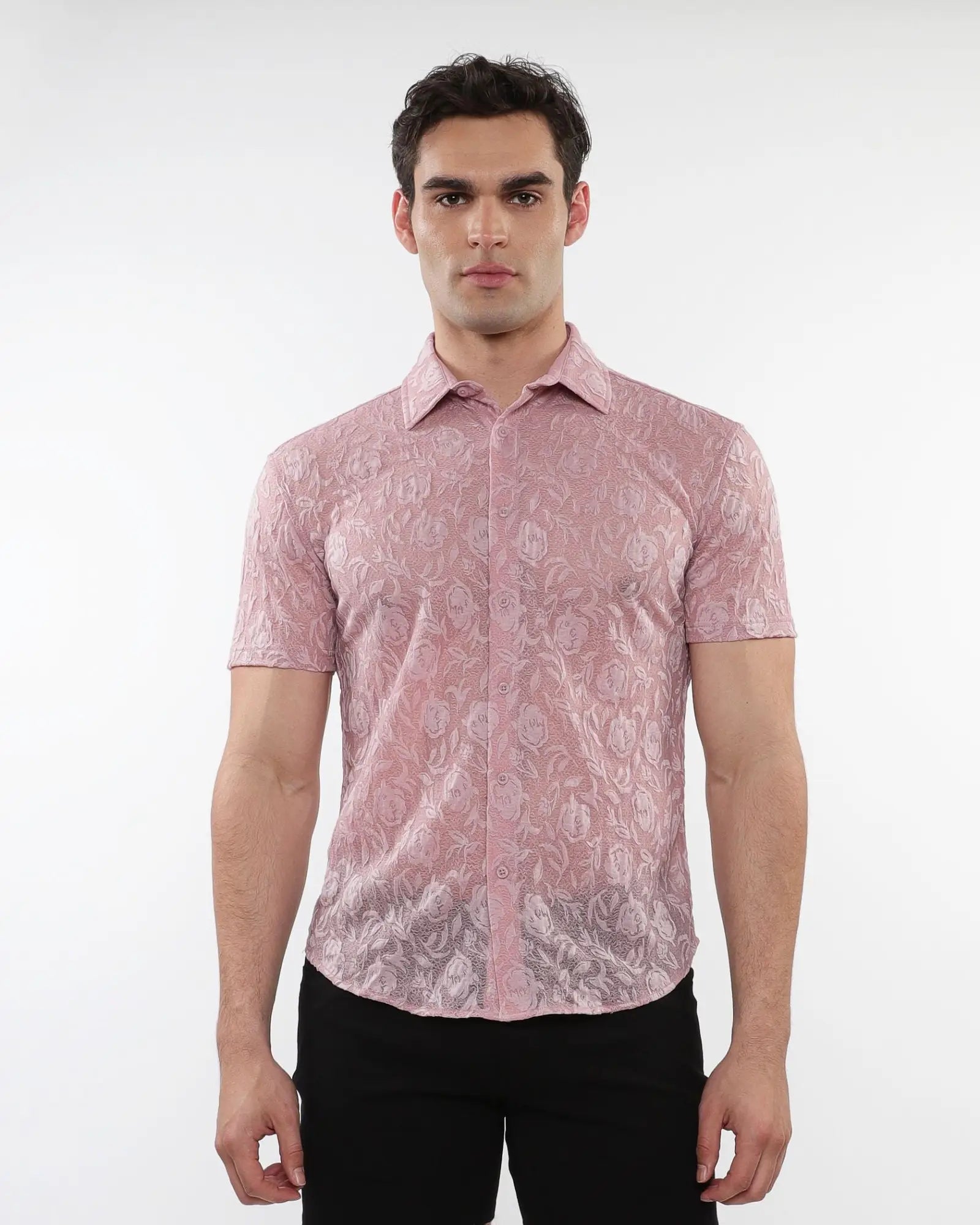 A man wearing a pink roses leaves gossamer knit short-sleeved shirt with intricate floral lace pattern