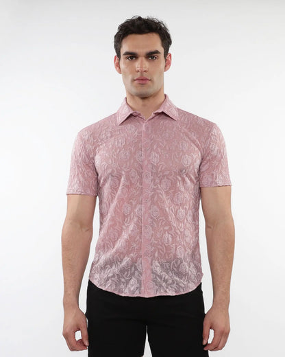 A man wearing a pink roses leaves gossamer knit short-sleeved shirt with intricate floral lace pattern