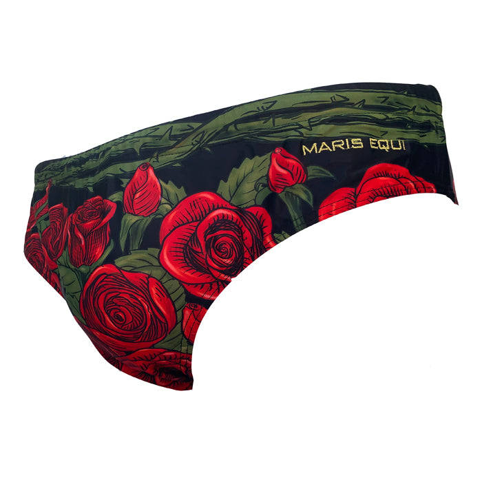 Men's swim briefs in black with red rose print and green leaves featuring Maris Equi branding on the side.