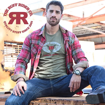 Olive green ruff riders victory short sleeved t shirt with white winged rr logo and red kings of victory text worn under plaid flannel