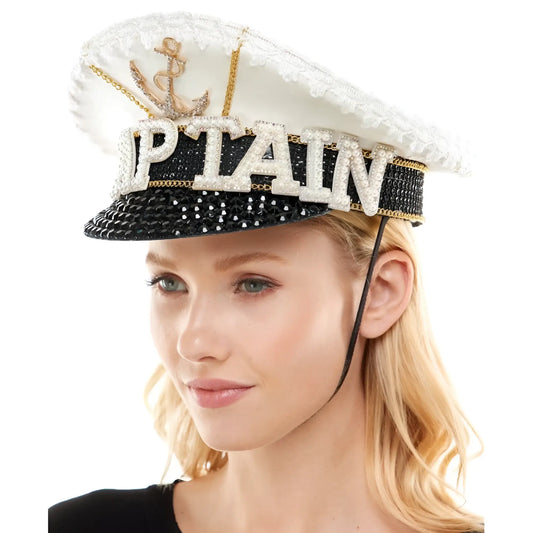 A sparkling white and black sailor captain hat with gold anchor rhinestone embellished captain lettering and sequins