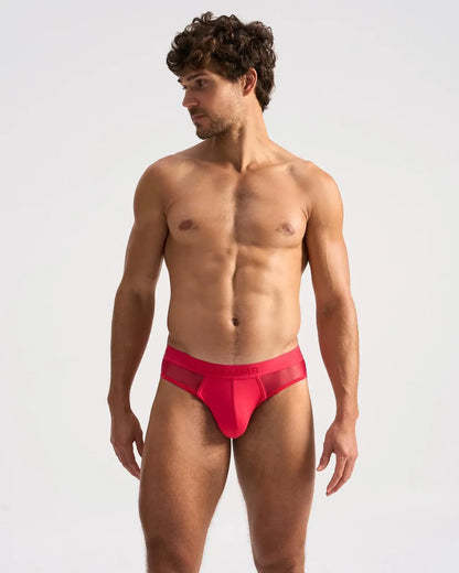 Bright red score sheer brief form-fitting briefs with a sheer mesh panel at the back visible in the image
