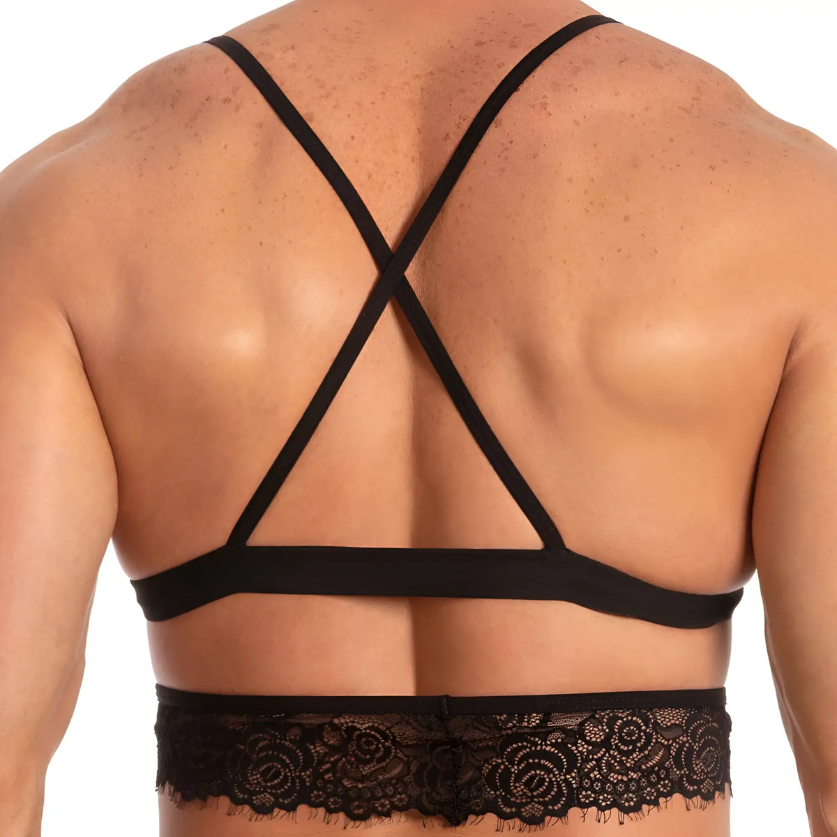 Black lace-trimmed bra with crisscross back straps shown from the back in secret male SMA017 tops and bras collection
