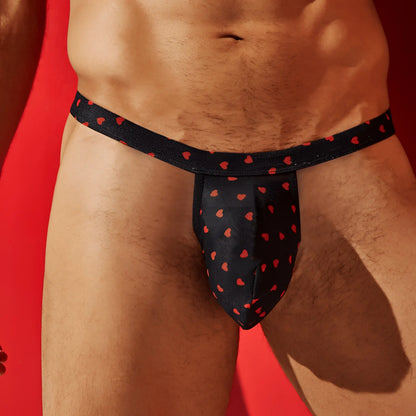 Secret male SMK022 flower laced thong with black fabric and red heart patterns for men