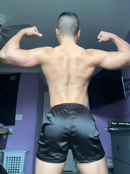 Black satin shimmerflex active shorts in midnight black highlighting sleek stretch fabric and athletic fit
