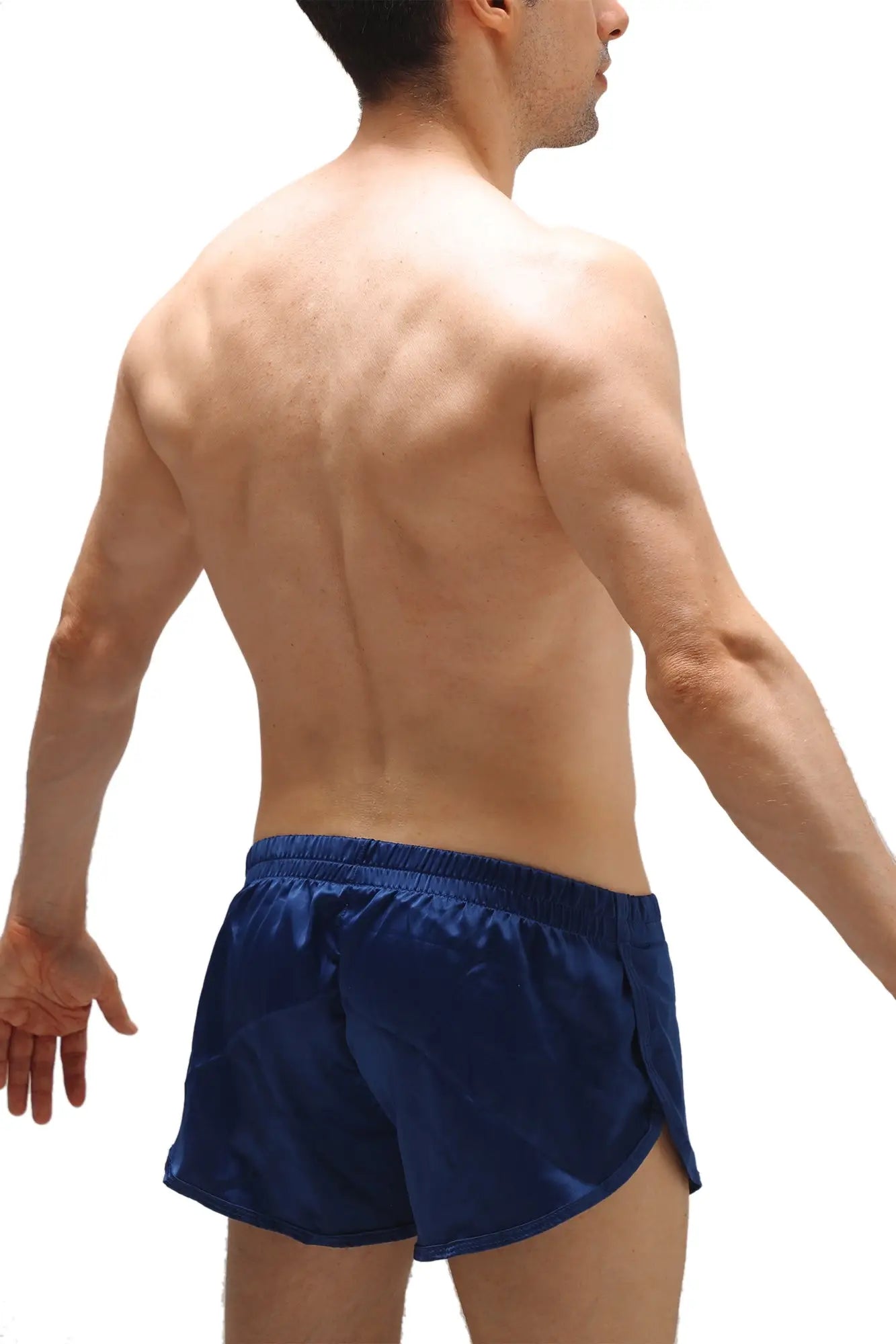 Navy blue satin shorts with an elastic waistband and jockstrap detail shown from the back side