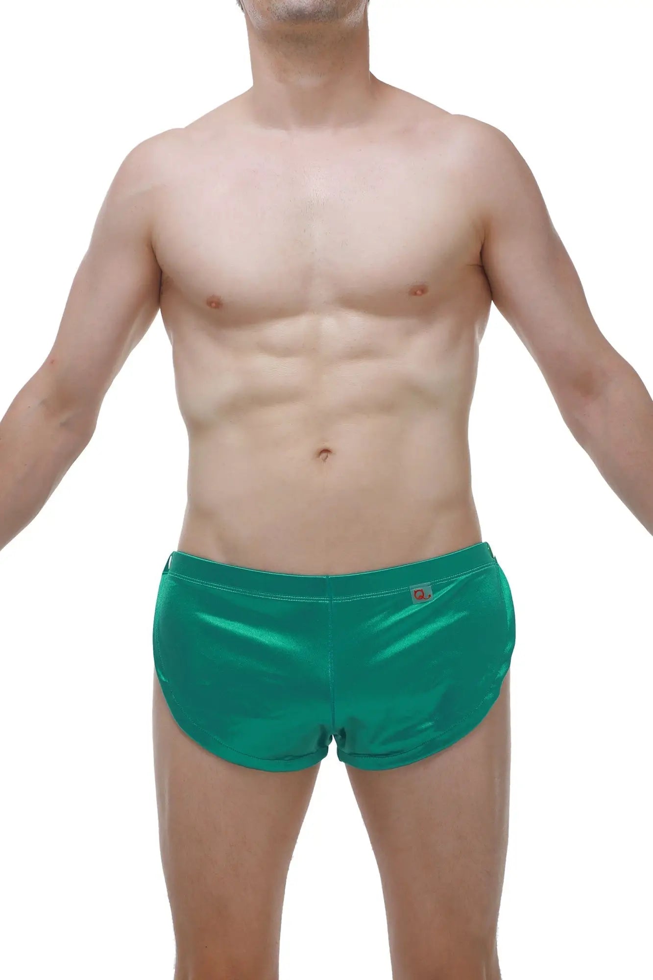 Shiny emerald green satin swim trunks with subtle waistband logo perfect for stylish beachwear and swimming