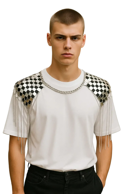 White t-shirt with black and silver checkered shoulder panels featuring dangling chain tassels for a stylish look