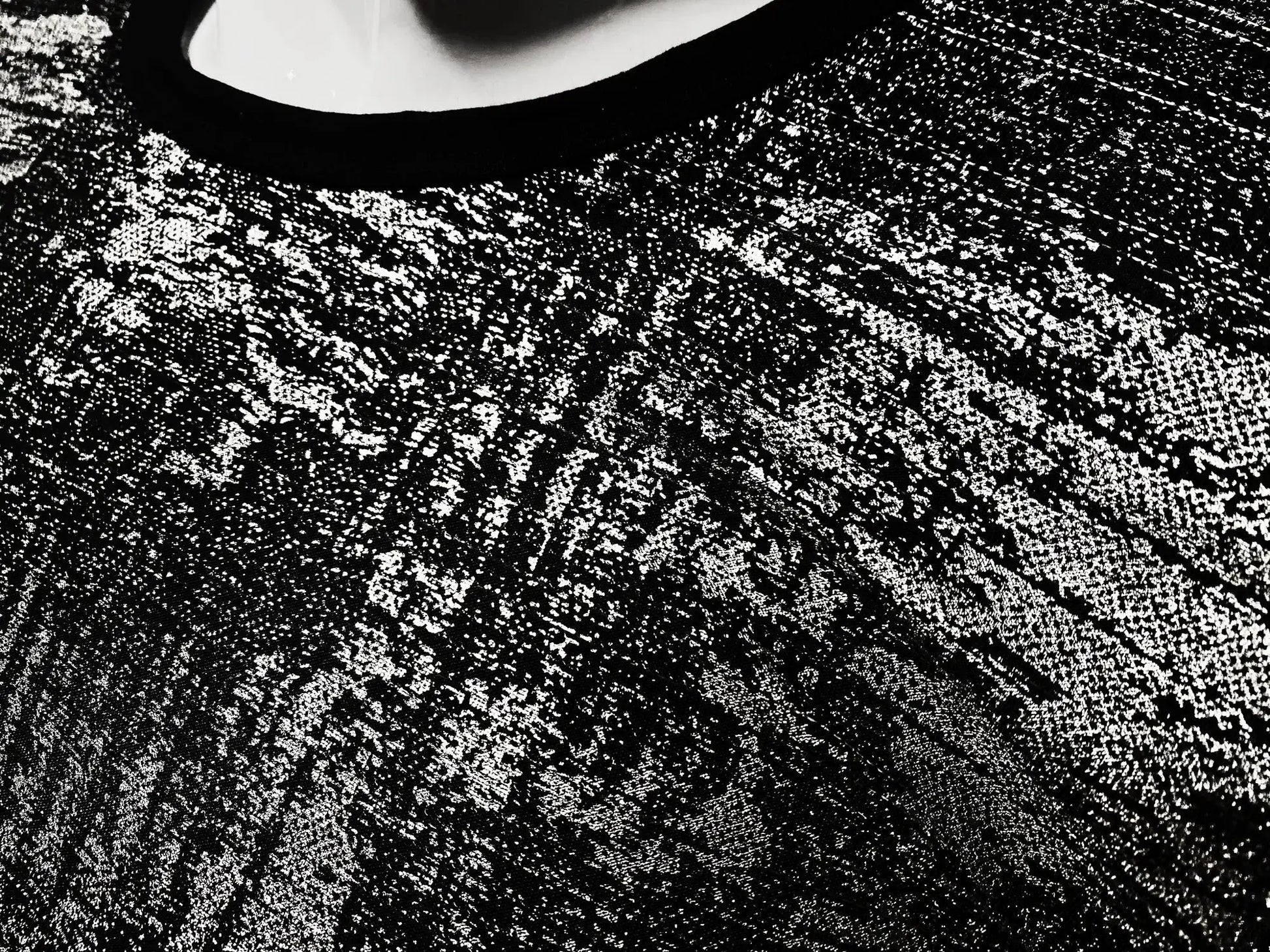 Black lace silver leaf tee with intricate textured pattern showcasing detailed craftsmanship
