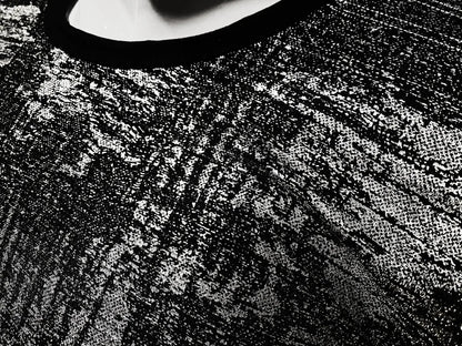 Black lace silver leaf tee with intricate textured pattern showcasing detailed craftsmanship