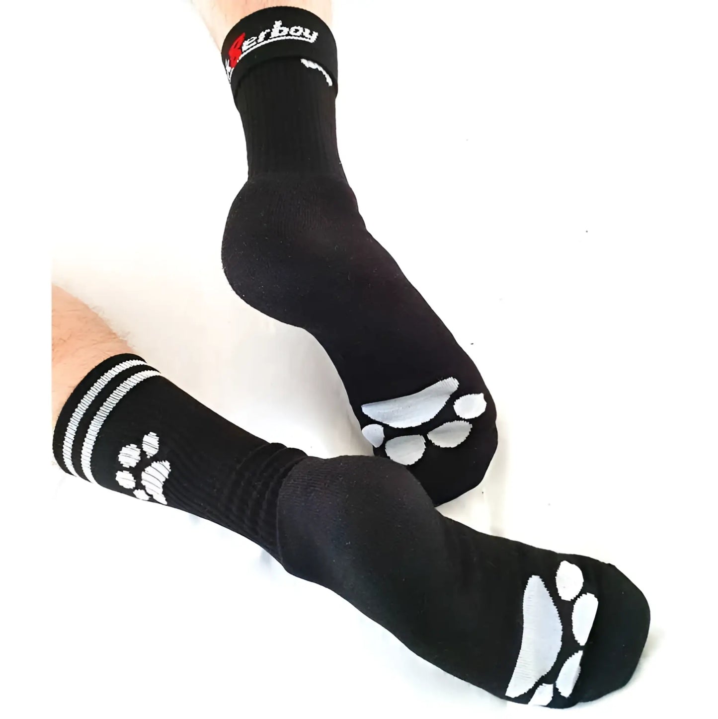Black sk8erboy puppy socks size 39-42 showing white paw prints on soles and stripes near cuffs on back side
