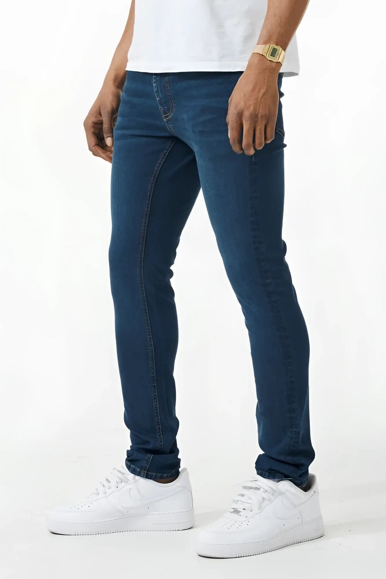 Dark blue skinny fit denim jean with slim fit, five-pocket design, and subtle fading along the thighs