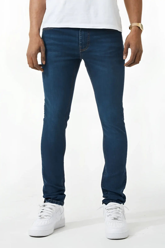 Dark blue skinny fit denim jeans with slim fit, classic five-pocket design, and subtle fading on thighs