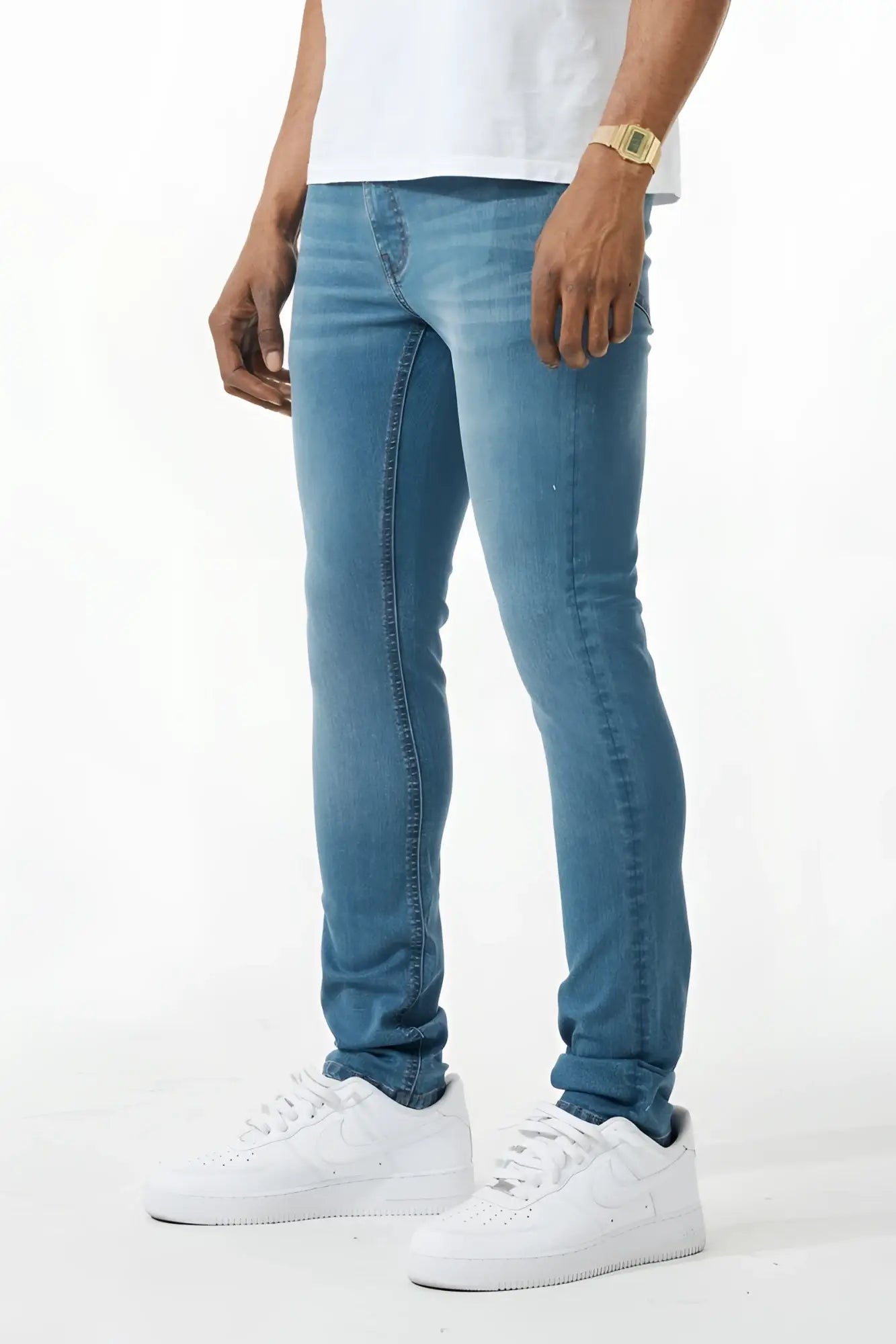 Light-wash blue skinny fit denim jean with classic five-pocket design and subtle fading along the thighs