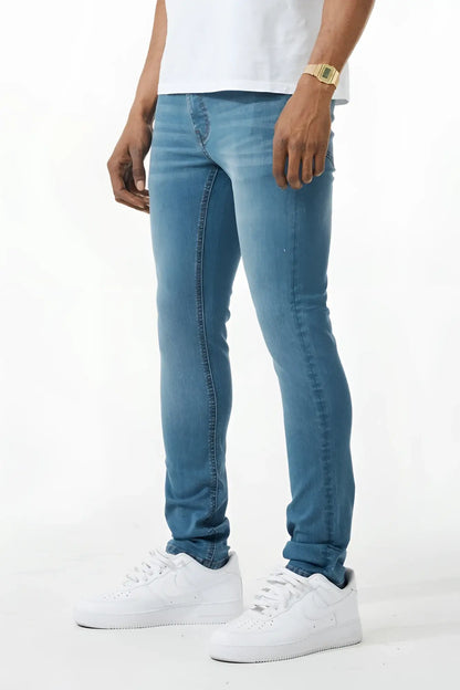 Light-wash blue skinny fit denim jean with classic five-pocket design and subtle fading along the thighs