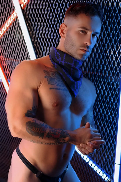 Blue patterned bandana worn around the neck in the slay-kerchief bound style accessory