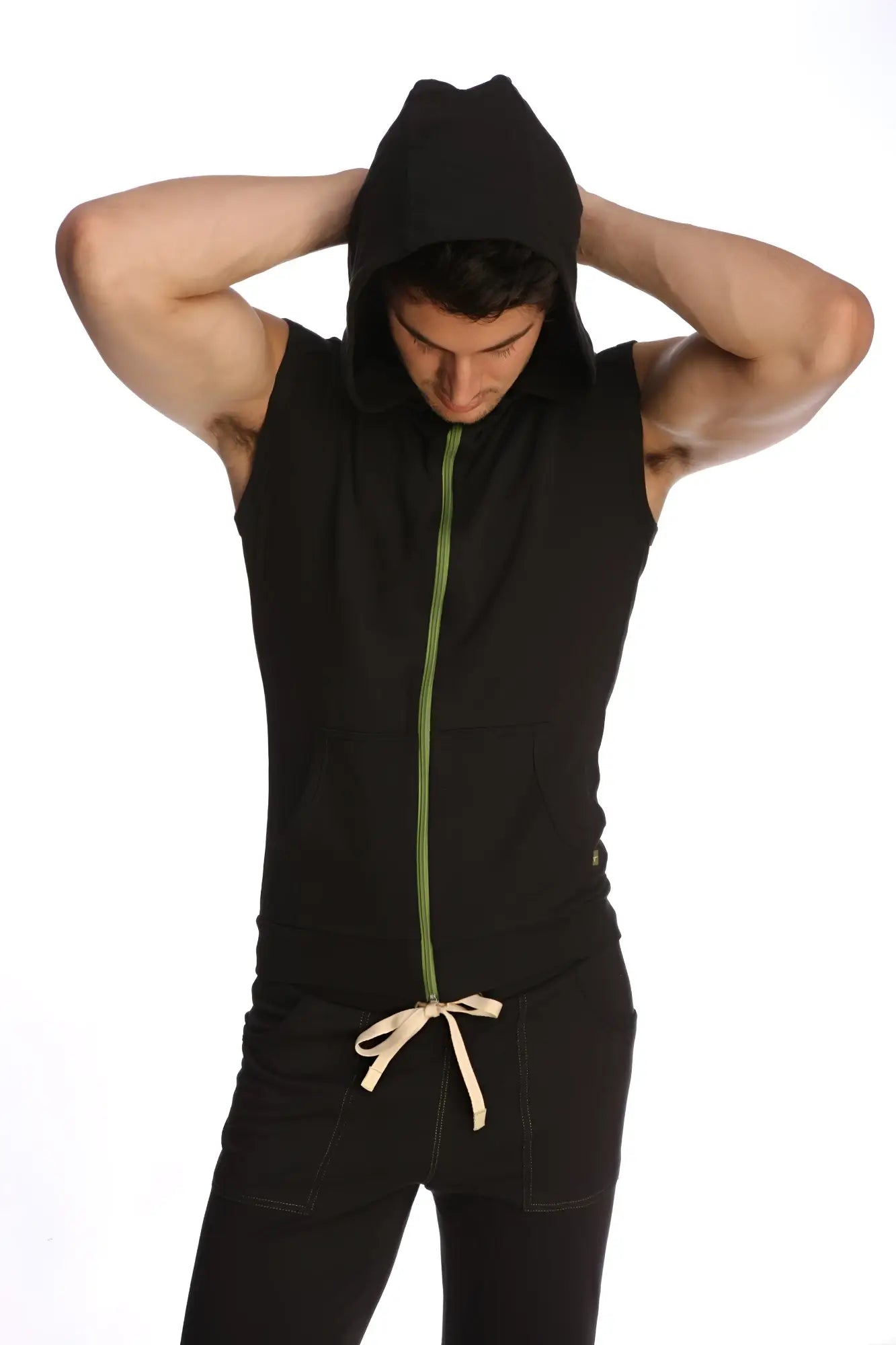 Black sleeveless yoga hoodie with green zipper and beige drawstring waist for comfortable activewear