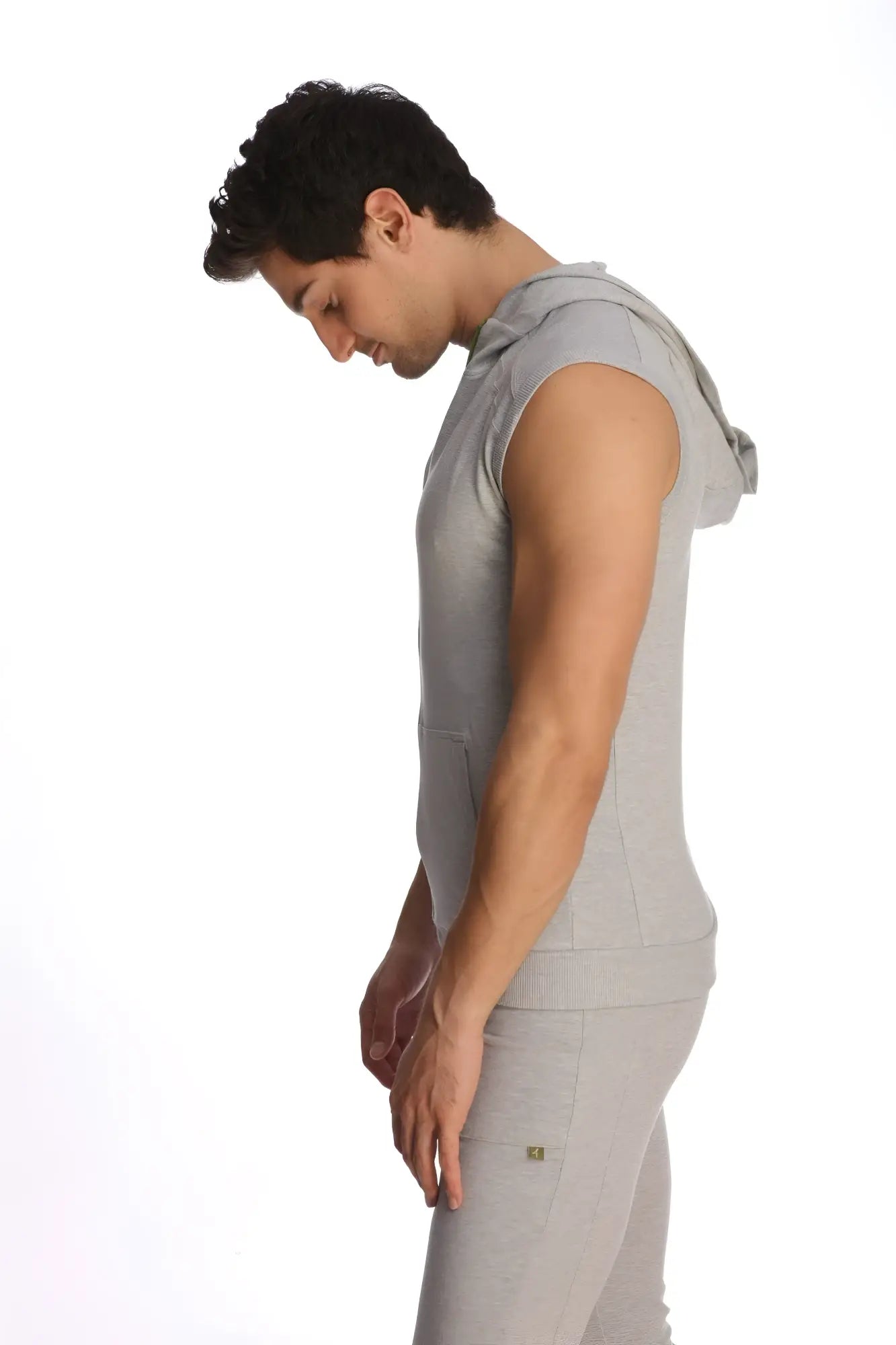 Gray sleeveless yoga hoodie with hood and front pocket made of soft heather grey fabric for comfortable workouts