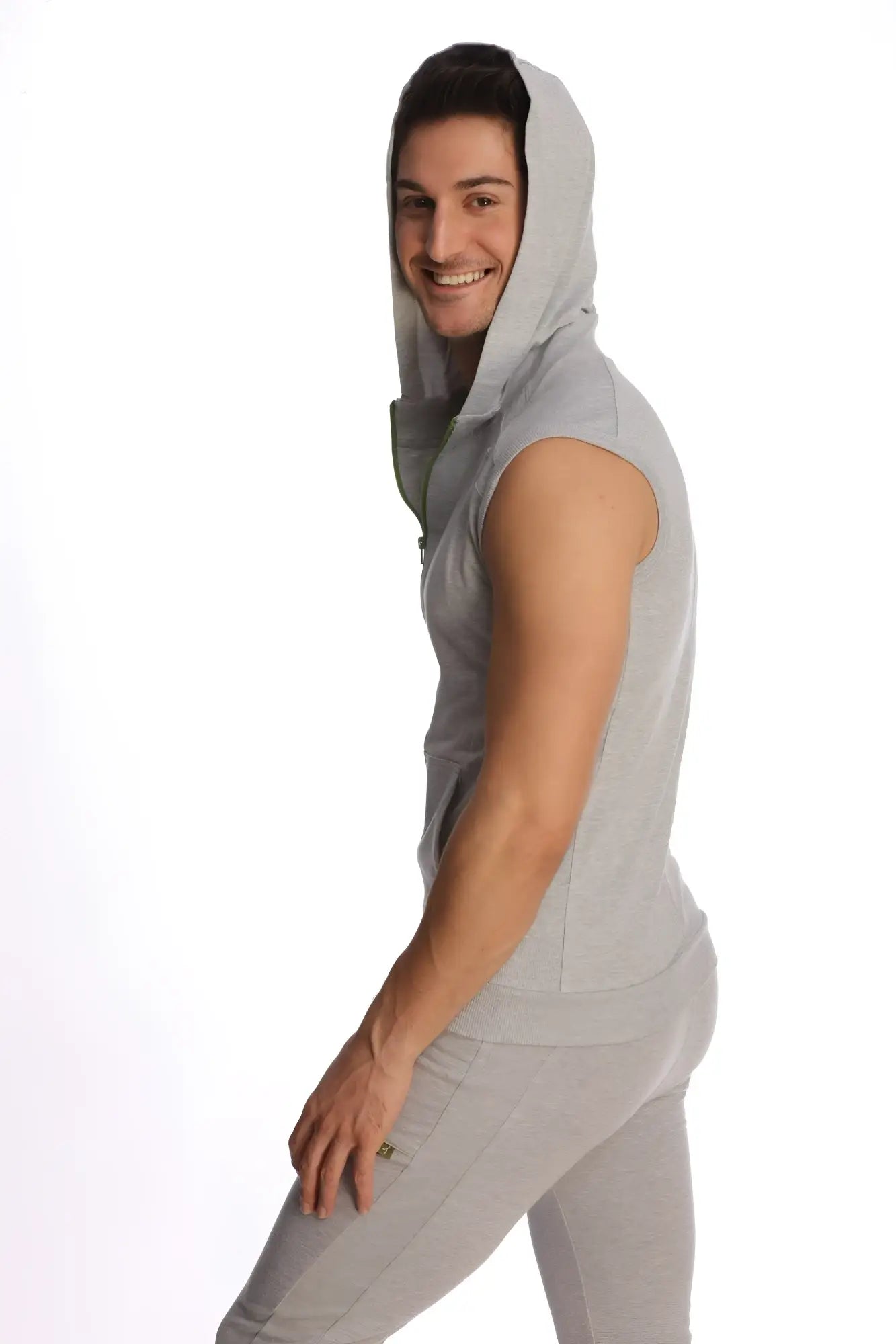 A light gray sleeveless yoga hoodie with a hood and front zipper made of soft fabric for comfortable wear