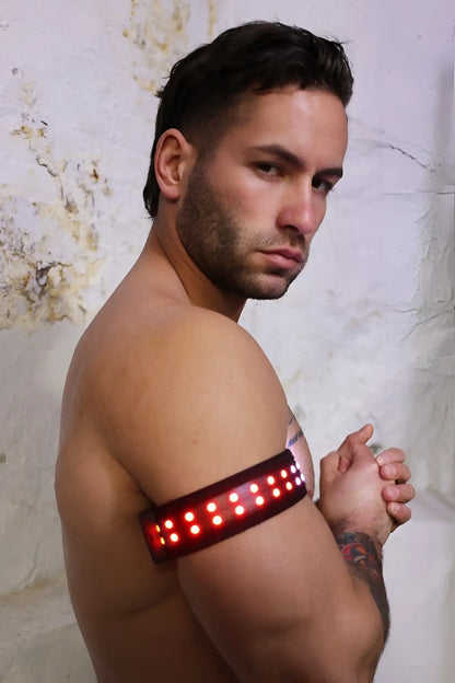 Soundwave armband red led light therapy armband worn on upper arm for pain relief and muscle recovery