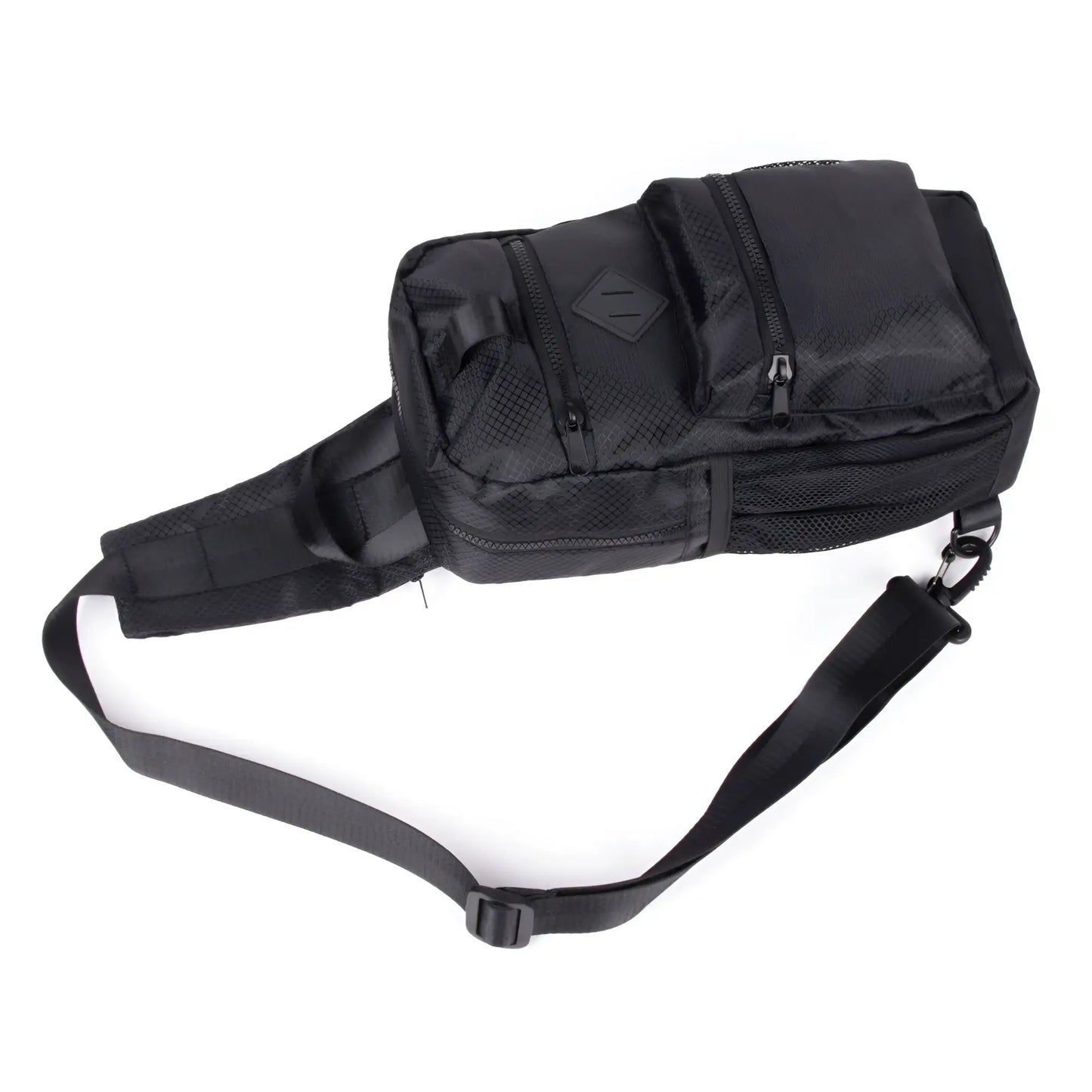 Black sport crossbody sling bag with mesh panels and multiple zippered compartments for tactical use