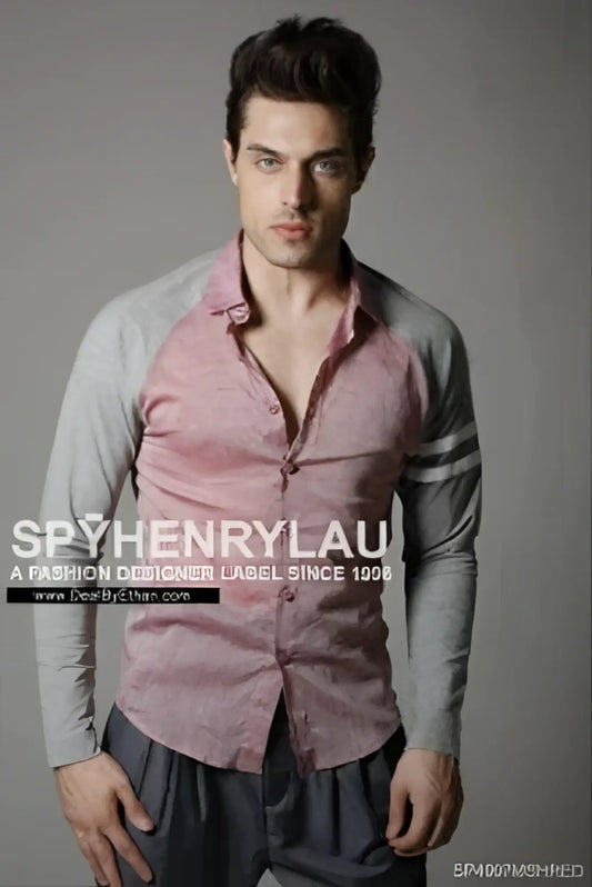 A man wearing a spy henry lau slim fit long sleeved button-up shirt with pink and gray contrast panels size L