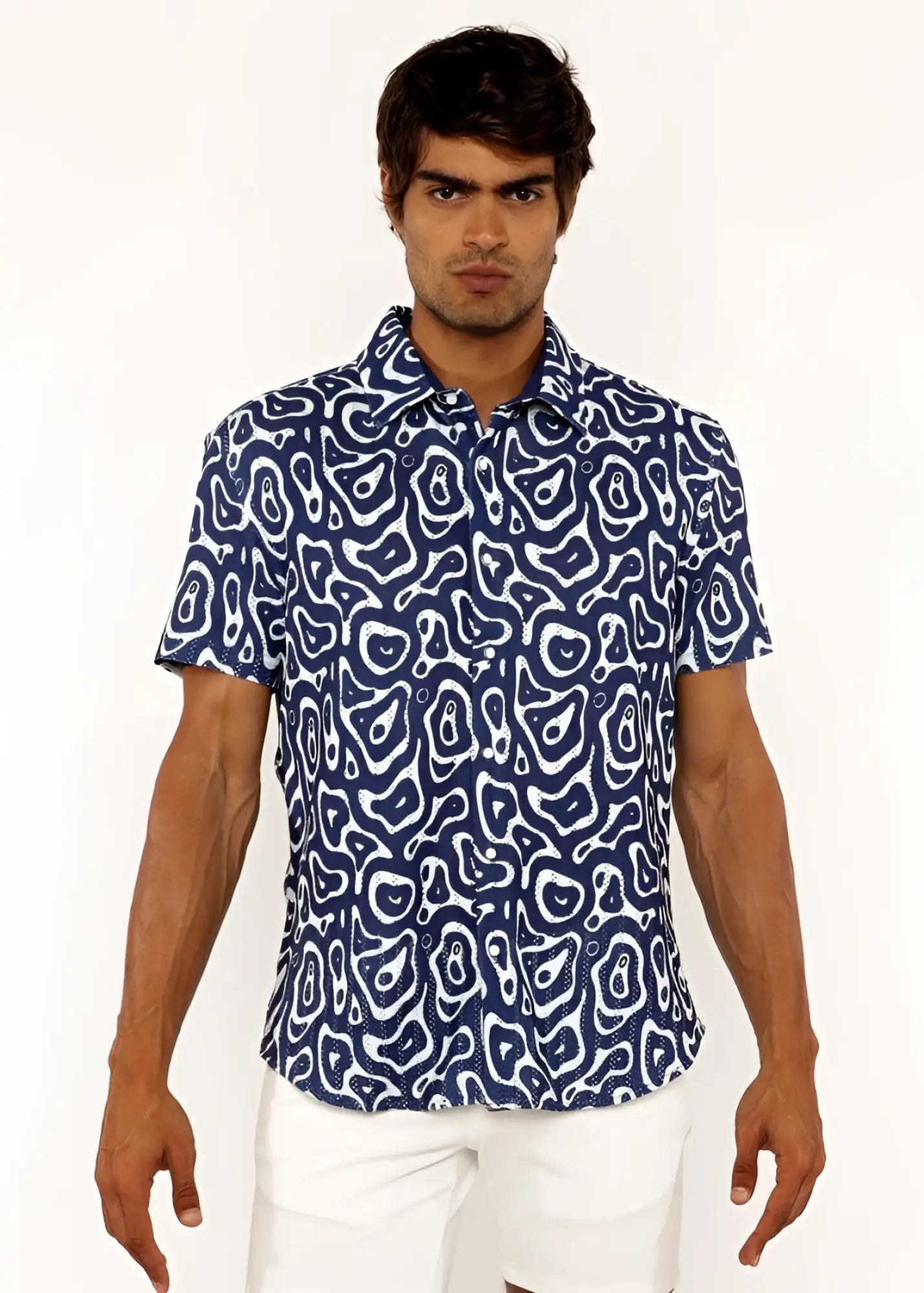 A navy blue short-sleeved squiggly print open knit shirt with a white abstract pattern in lightweight fabric