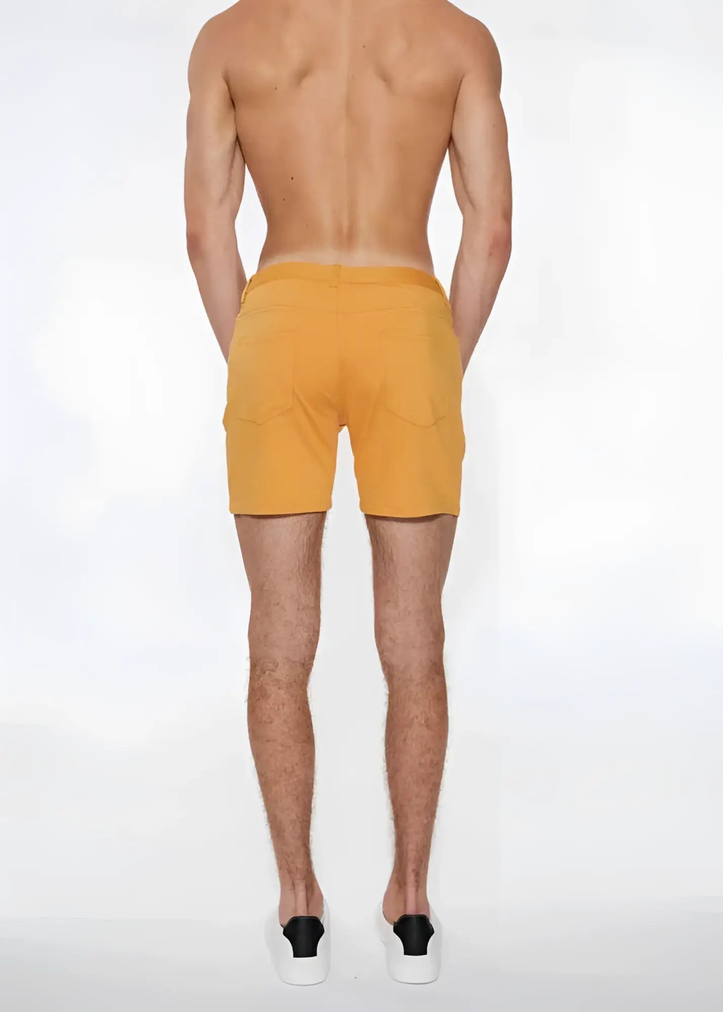 A pair of apricot peel stretch knit men’s shorts with side pockets in size 28 and a simple design