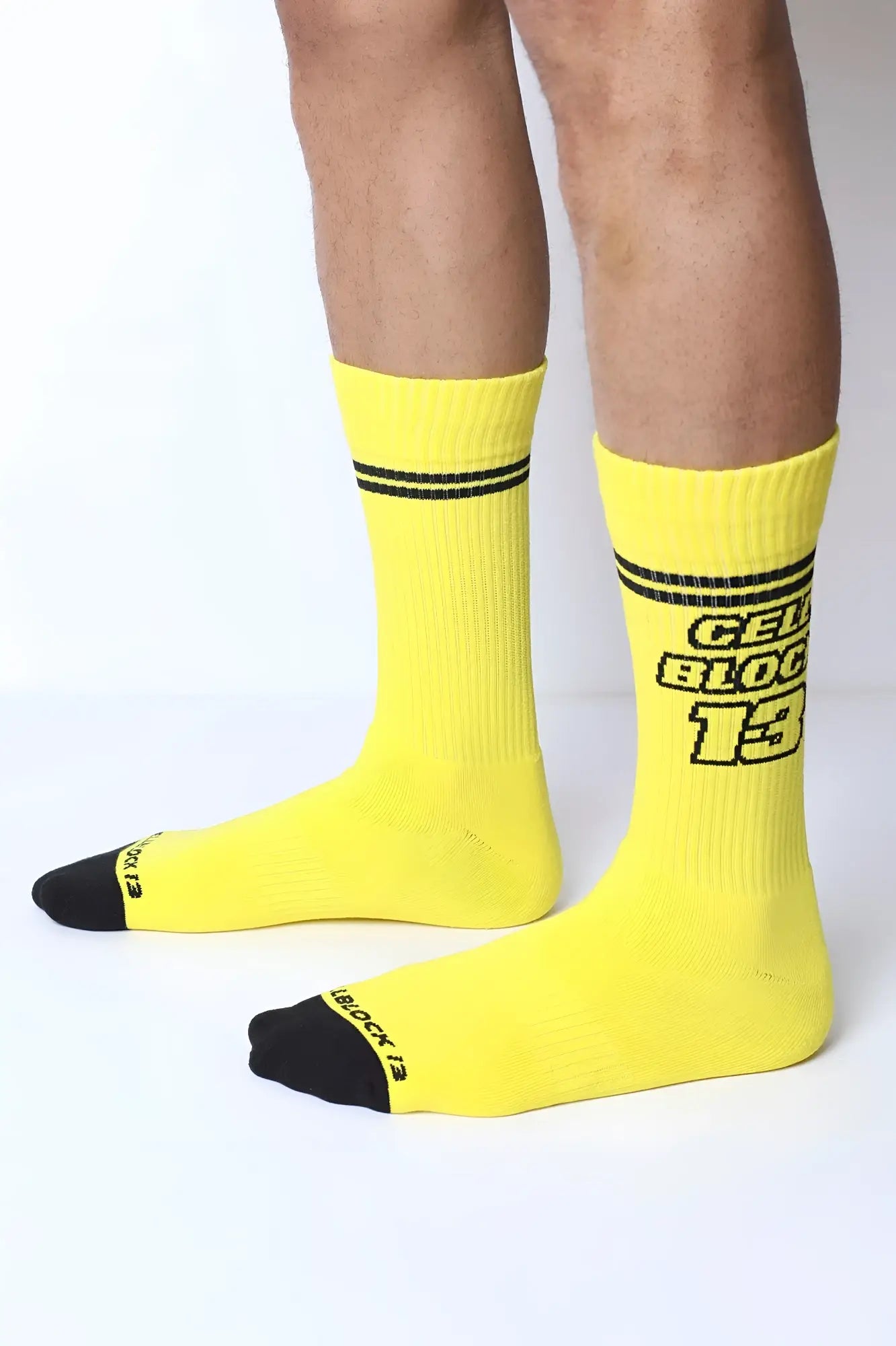 Starter crew socks in bright yellow with black toe caps and stripes featuring bold gelb block 13 text on the side