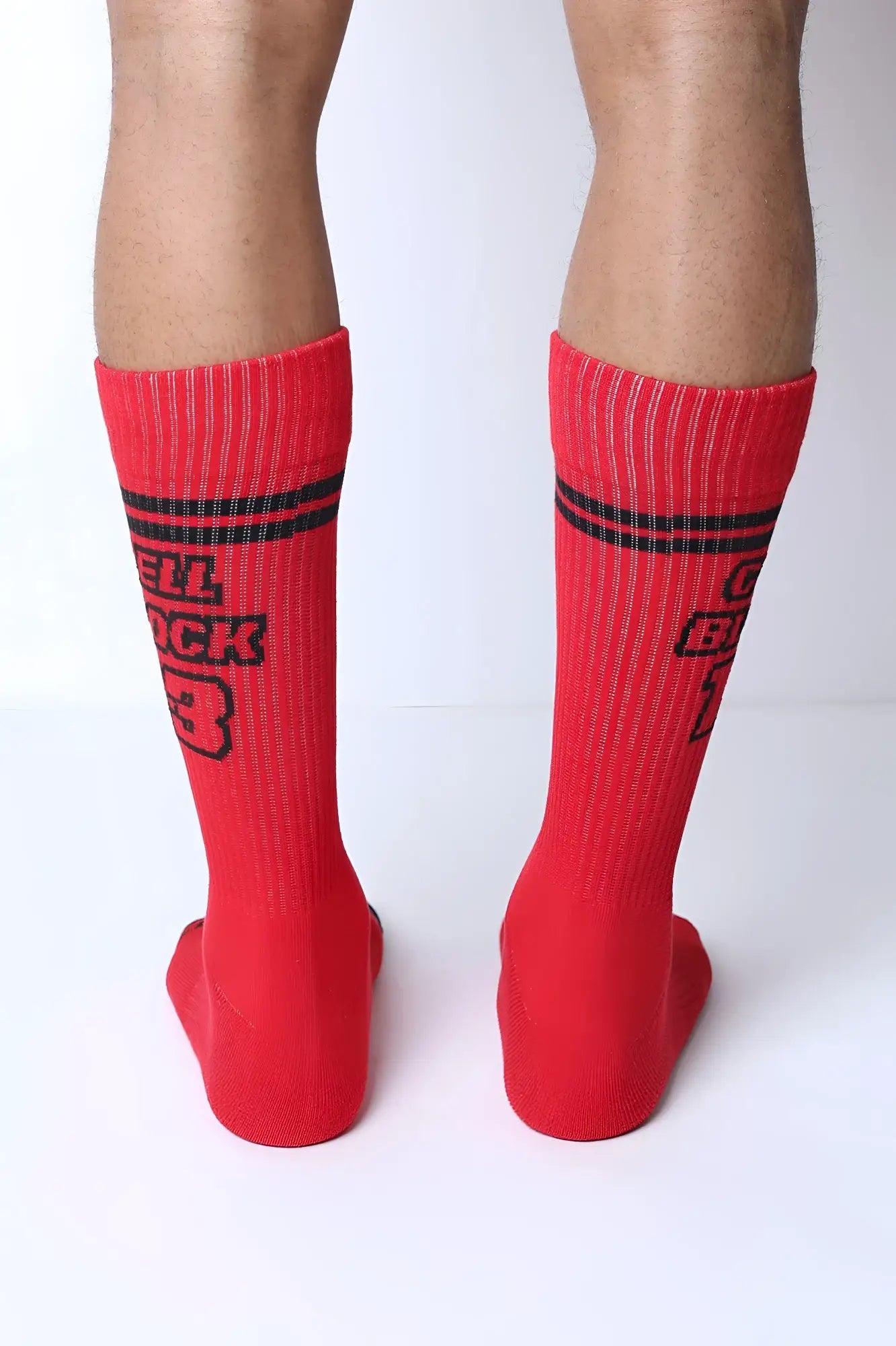 Starter crew socks featuring red crew socks with black horizontal stripes and bold hell buck 3 text