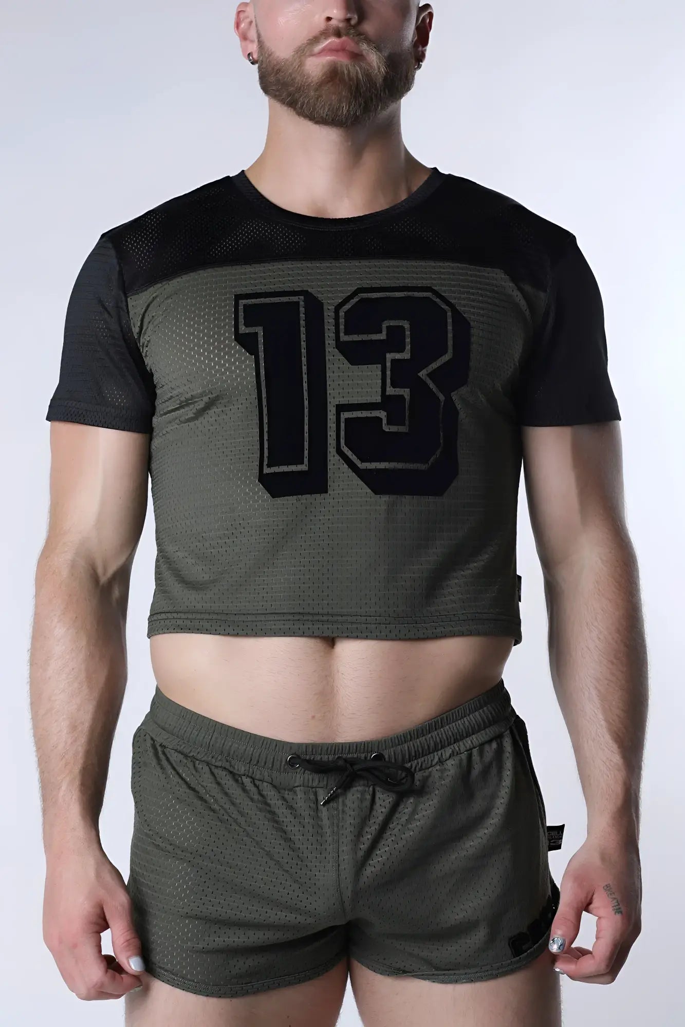 Starter mesh crop top featuring an olive green mesh body, black short sleeves, and a bold 13 graphic on the chest