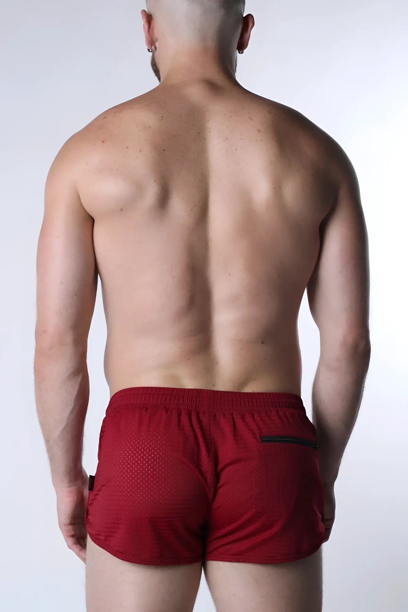 Red starter mesh short athletic shorts with mesh texture and black trim on side pockets