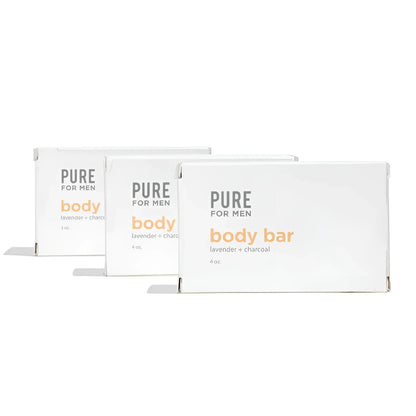 Three white rectangular boxes of pure for men lavender and charcoal body bar labeled stay ready bar in orange and gray text