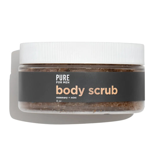 A clear jar with a white lid contains brown granular body scrub labeled pure for men stay ready scrub