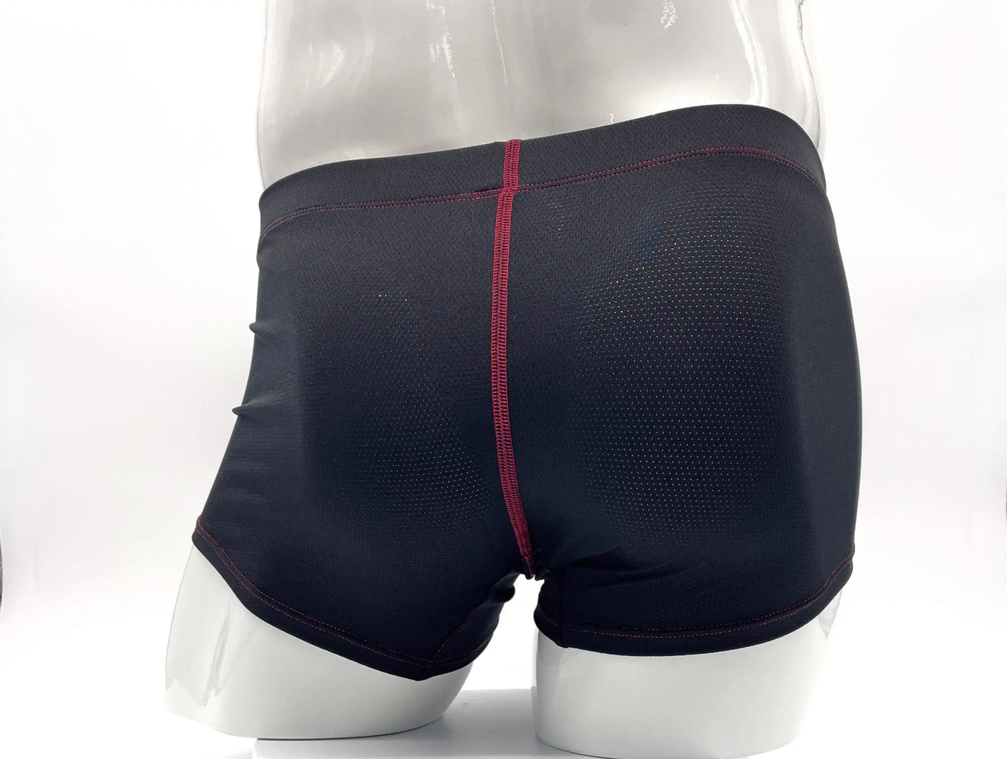 Black stitch big boy pouch boxer brief with red central seam and breathable mesh texture for athletic use