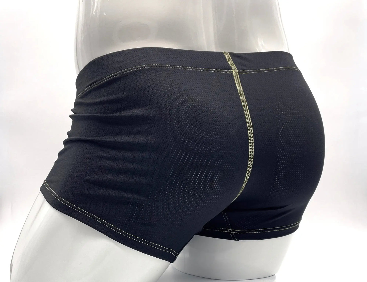 Back side of black stitch big boy pouch boxer brief with mesh texture and light green stitching along the seam