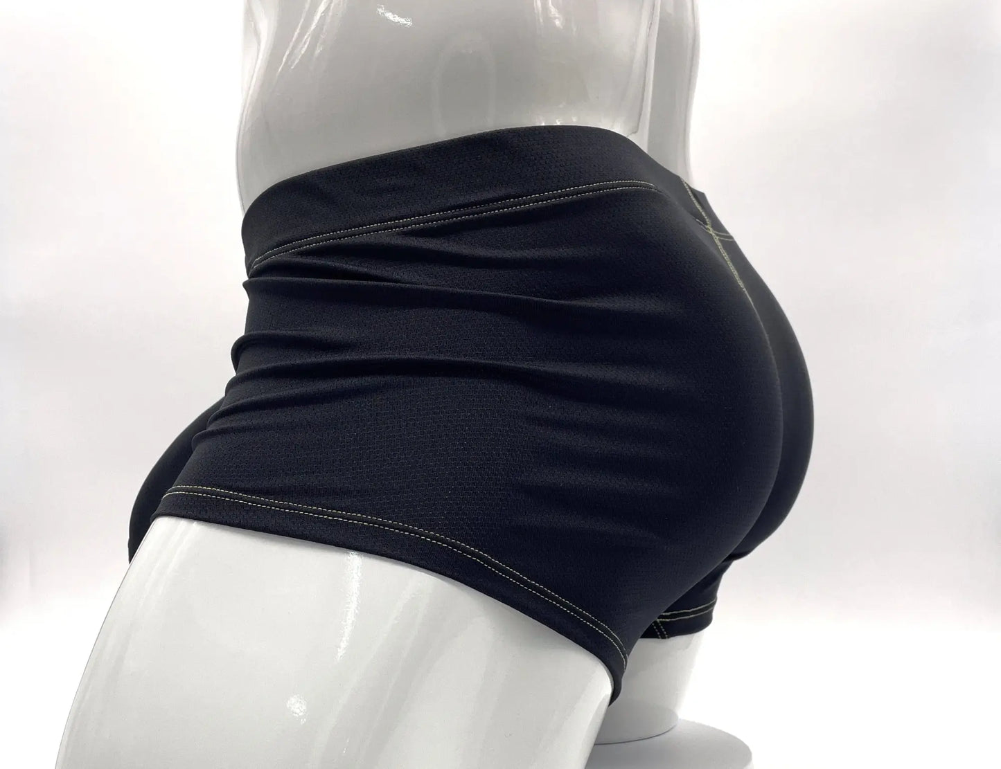 Stitched big boy pouch boxer brief in yellow with black athletic shorts featuring white stitching on waistband and hem