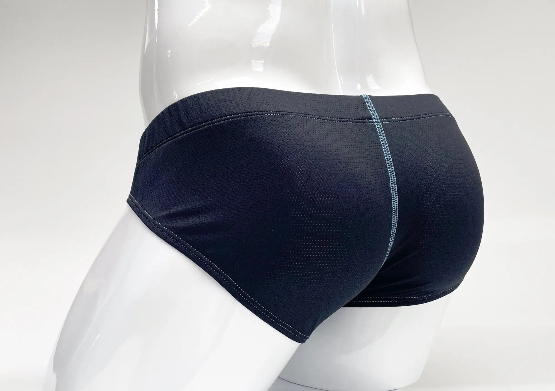 Stitch big boy pouch brief in black with subtle mesh texture and light gray stitching along center seam
