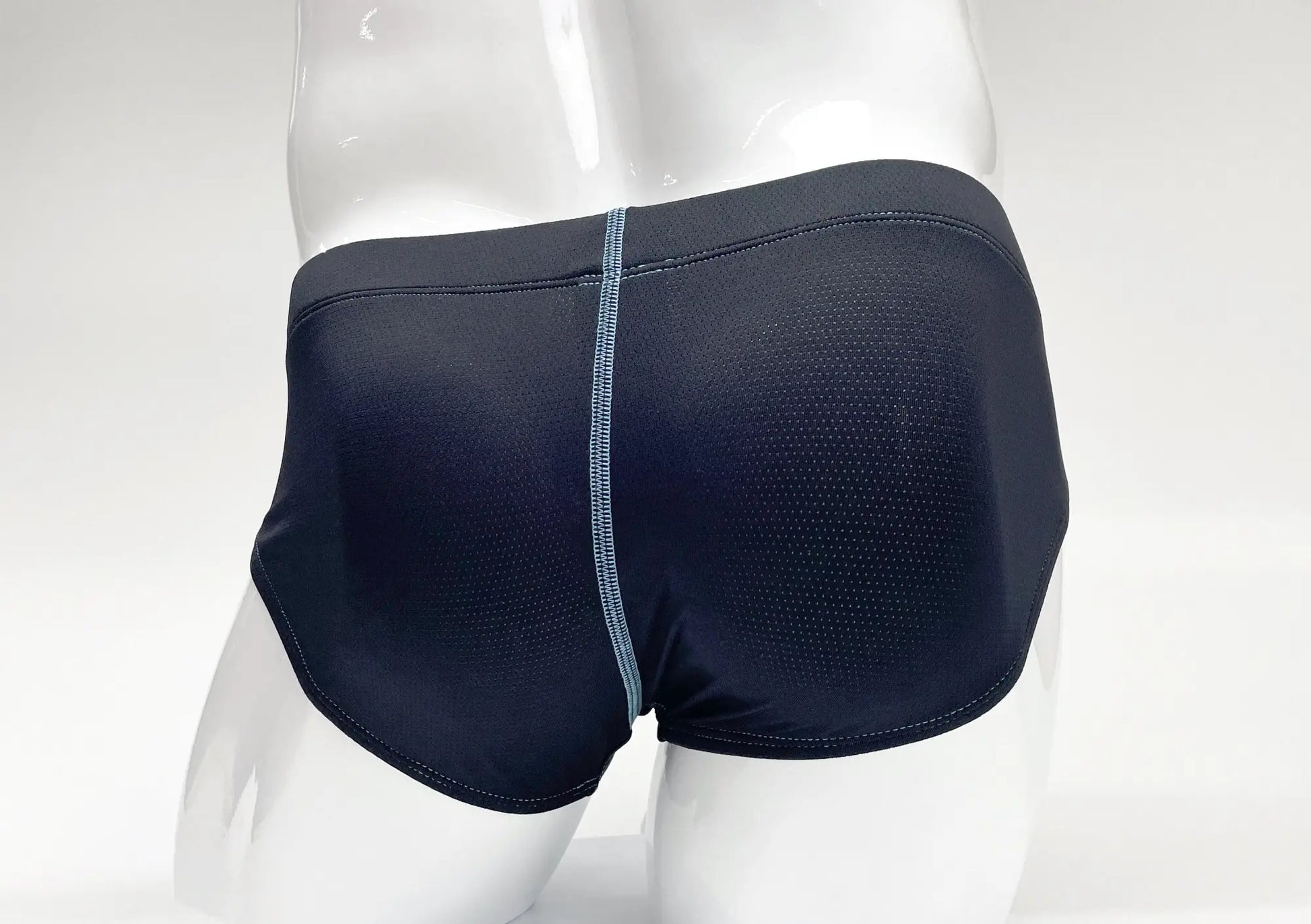 Back view of stitch big boy pouch brief blue black mesh swim trunks with a subtle light blue center back seam