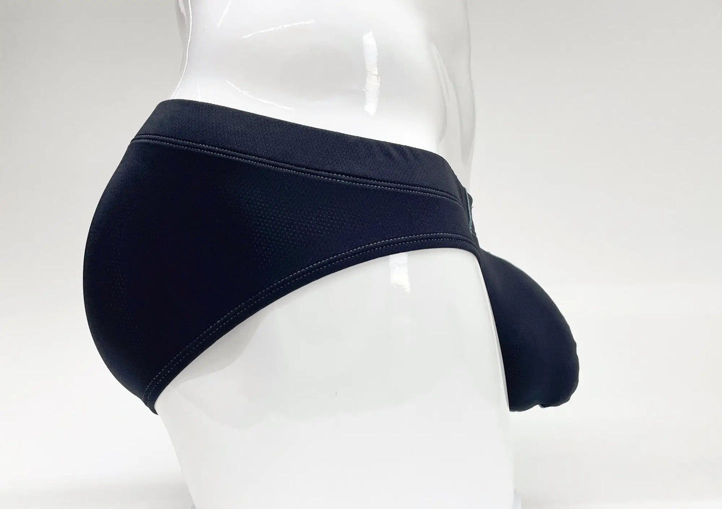 Stitch big boy pouch brief blue in black form-fitting swim trunks with smooth stretchy fabric and reinforced waistband stitching